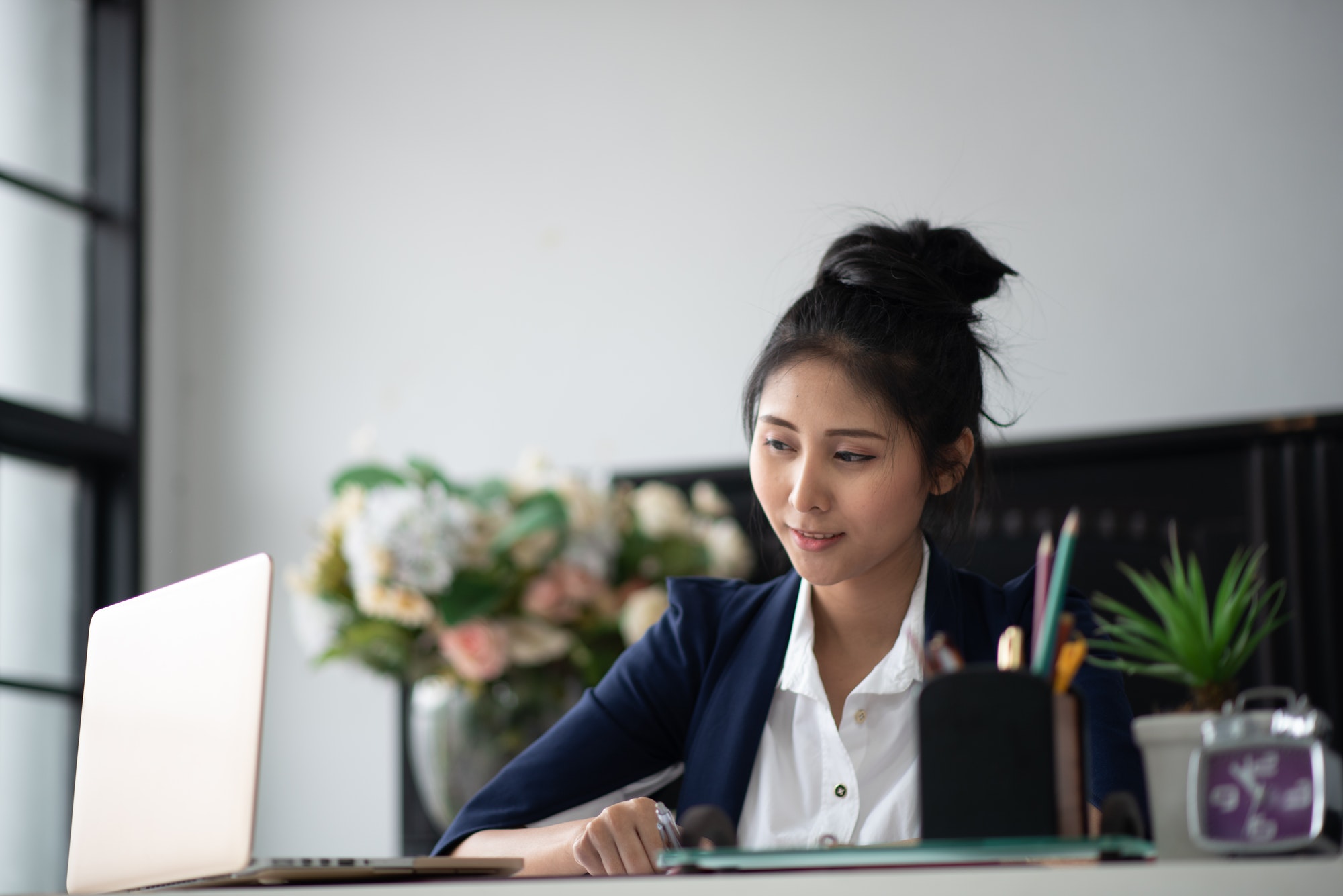 Asian business women in suits working in offices Business concepts and new company development